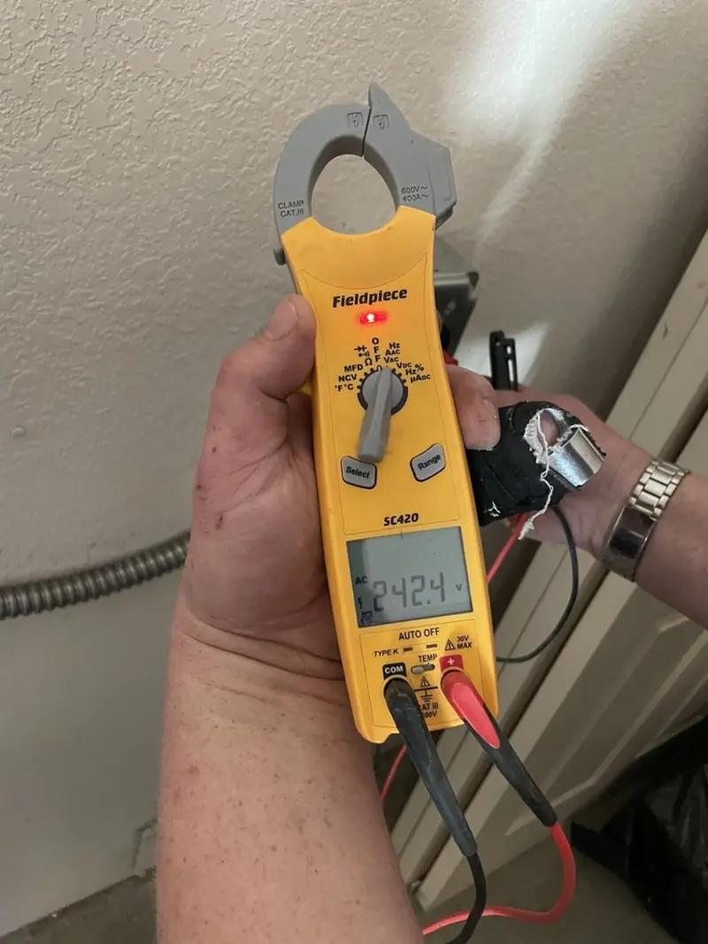 Voltage testing with clamp meter during Electrical Installation Services in Mount Rainier